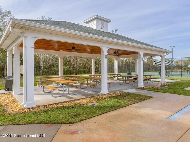 surrounding community with a gazebo, fence, and a patio