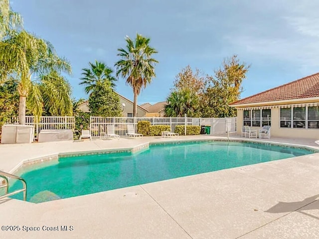 view of swimming pool with a fenced in pool, a patio, and fence