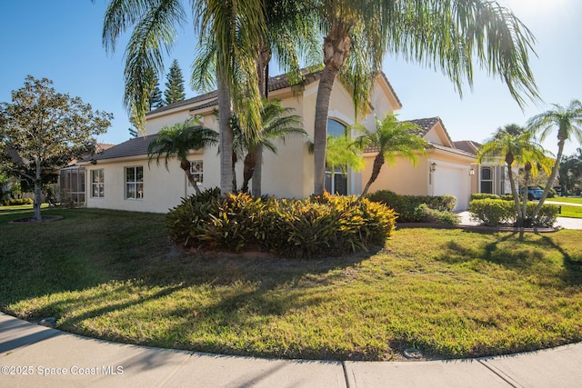 view of property exterior with a tile roof, an attached garage, a yard, and stucco siding