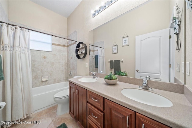 bathroom with a sink, toilet, shower / bath combo, and double vanity