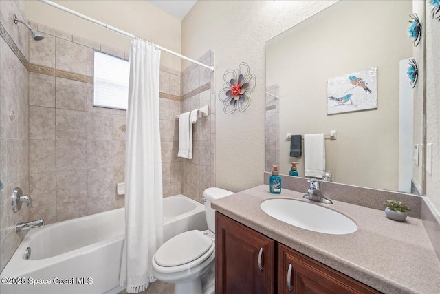 full bath featuring vanity, shower / tub combo, and toilet