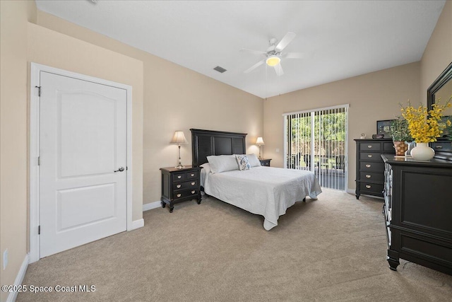 bedroom with access to outside, light colored carpet, visible vents, and ceiling fan