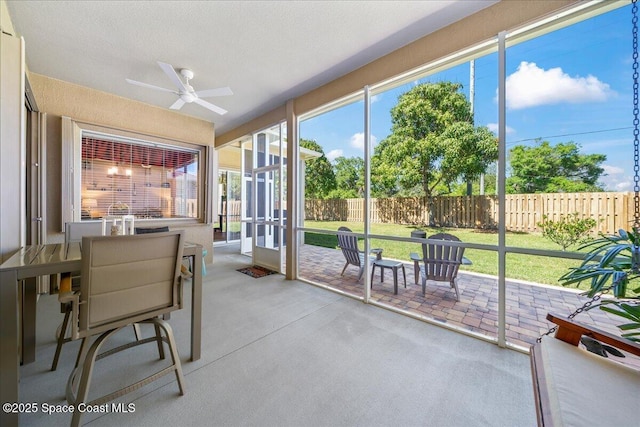 sunroom / solarium with ceiling fan