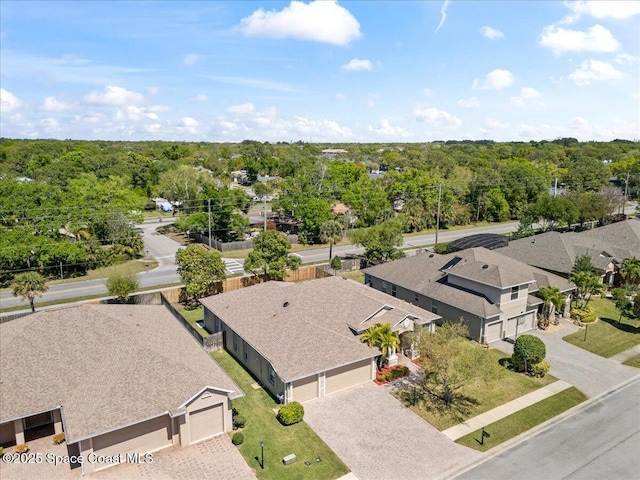 bird's eye view with a residential view and a view of trees