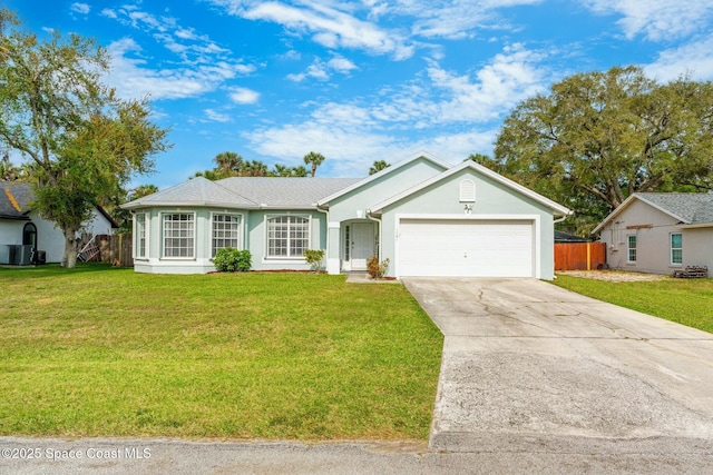 single story home featuring a front yard, an attached garage, fence, and concrete driveway