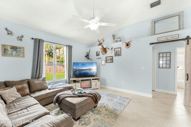 living area featuring visible vents, ceiling fan, lofted ceiling, a barn door, and light tile patterned floors