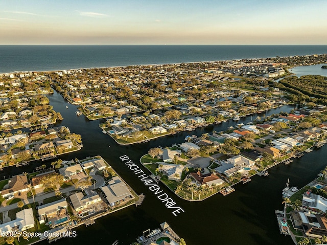 drone / aerial view featuring a water view and a residential view