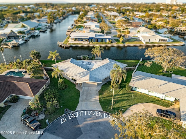 bird's eye view with a residential view and a water view