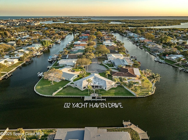 bird's eye view featuring a residential view and a water view