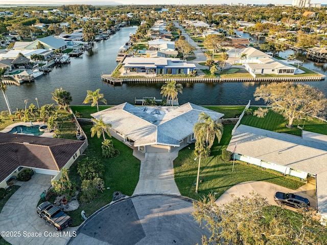 birds eye view of property featuring a residential view and a water view