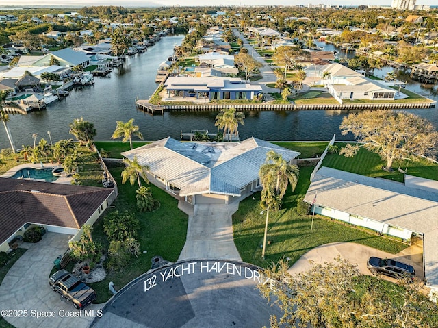 bird's eye view featuring a residential view and a water view