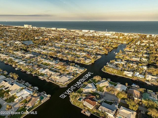 aerial view with a residential view and a water view