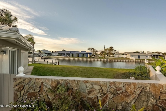 view of water feature featuring a residential view and a boat dock