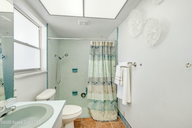 bathroom featuring tile patterned floors, curtained shower, toilet, and vanity