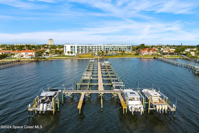 dock area with a water view and boat lift