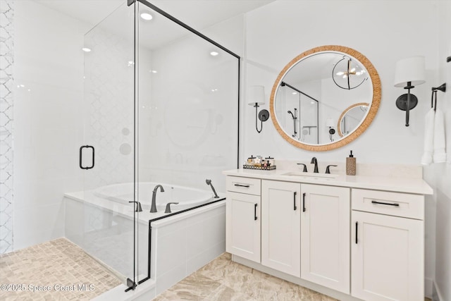 full bathroom with vanity, a bath, and a shower stall