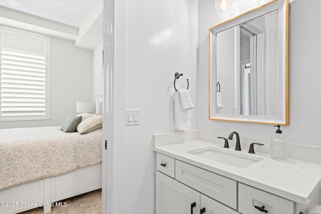 bathroom featuring connected bathroom and vanity