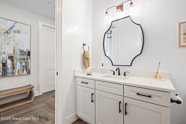 bathroom featuring baseboards and vanity