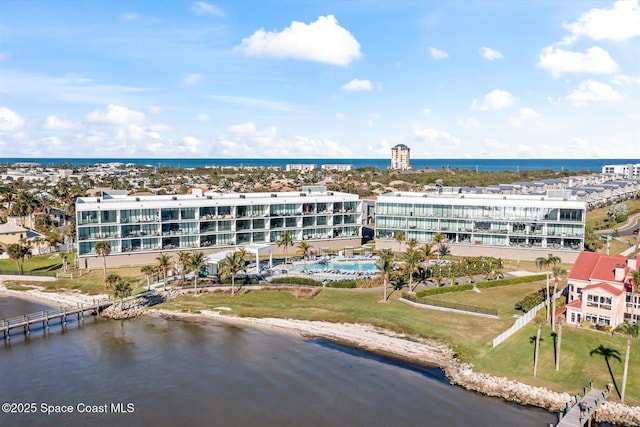 birds eye view of property with a water view