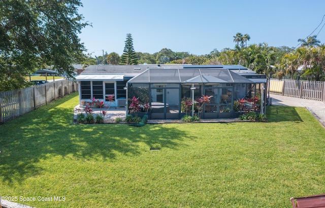 324 Harbor Dr, Cape Canaveral, FL 32920 - rear view of property with a patio area and glass enclosure