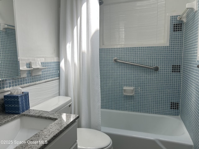 324 Harbor Dr, Cape Canaveral, FL 32920 - bathroom featuring tile walls, vanity, toilet, and shower / bath combo