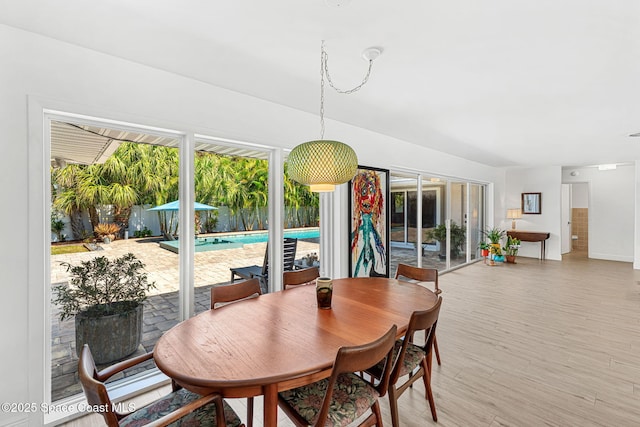 dining area with light wood finished floors