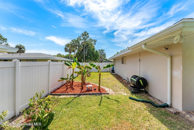 view of yard with a fenced backyard