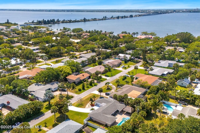 bird's eye view featuring a water view and a residential view