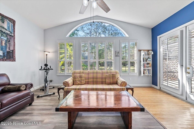 living room with light wood-style flooring, a healthy amount of sunlight, and ceiling fan