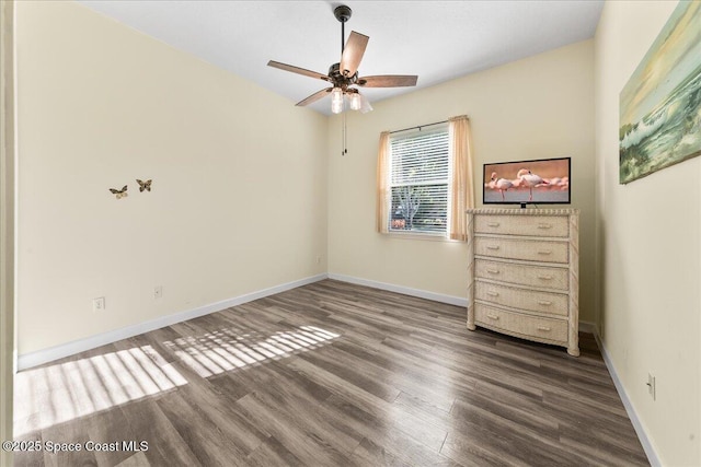 unfurnished bedroom featuring wood finished floors, baseboards, and ceiling fan