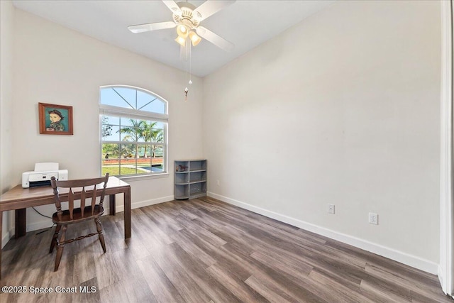 home office featuring wood finished floors, baseboards, and ceiling fan