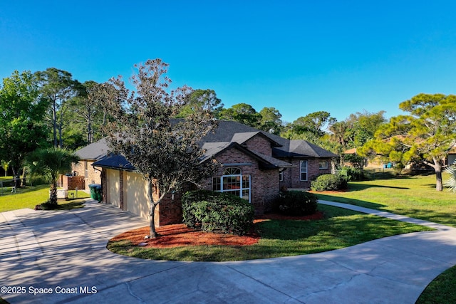 view of front of property featuring a garage, driveway, brick siding, and a front lawn