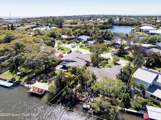 bird's eye view featuring a residential view and a water view