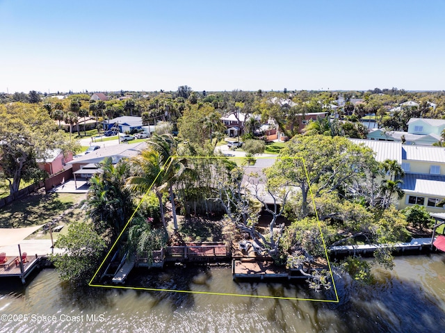 birds eye view of property featuring a water view and a residential view