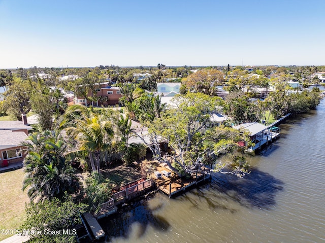 drone / aerial view featuring a residential view and a water view