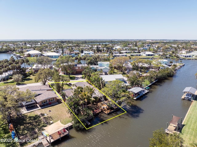 aerial view featuring a residential view and a water view