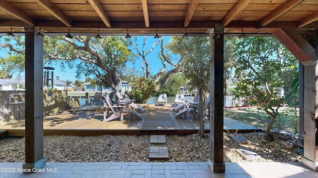 exterior space featuring a deck and fence