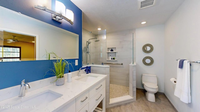 full bath with walk in shower, visible vents, and a sink