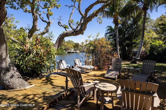 view of patio featuring a boat dock and a water view