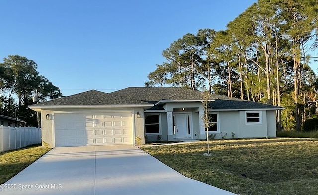 single story home featuring stucco siding, driveway, fence, a front yard, and an attached garage