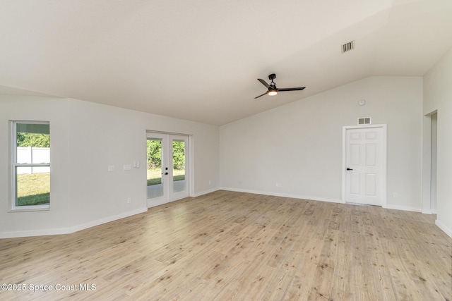 531 Ortega St SE, Palm Bay, FL 32909 - spare room with light wood finished floors, visible vents, ceiling fan, lofted ceiling, and french doors