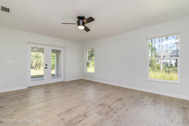 531 Ortega St SE, Palm Bay, FL 32909 - unfurnished room with a ceiling fan, visible vents, light wood finished floors, baseboards, and french doors