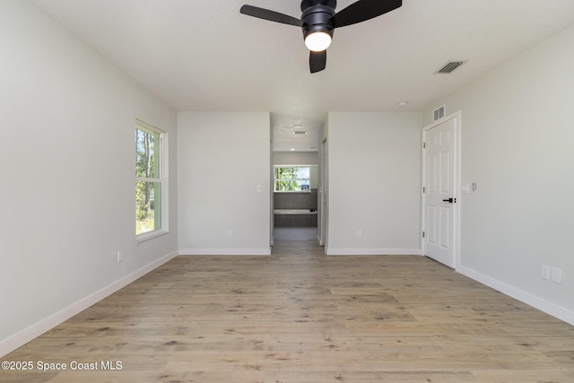 531 Ortega St SE, Palm Bay, FL 32909 - spare room with visible vents, baseboards, light wood-style floors, and a ceiling fan