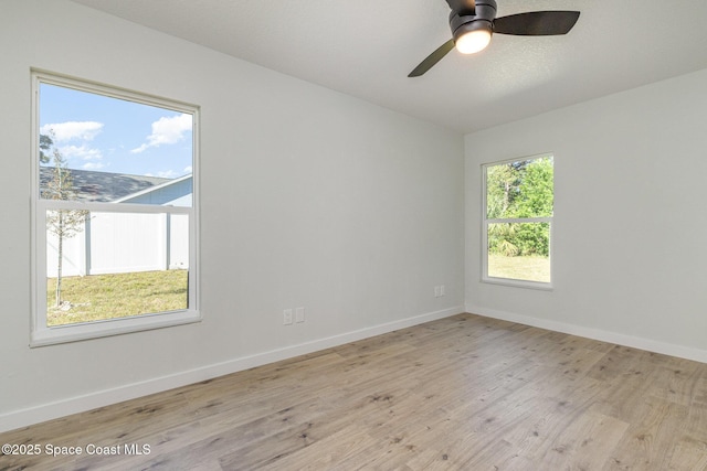 531 Ortega St SE, Palm Bay, FL 32909 - unfurnished room with wood finished floors, baseboards, and ceiling fan