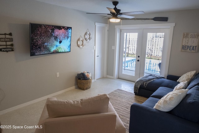 living room with ceiling fan, french doors, and baseboards