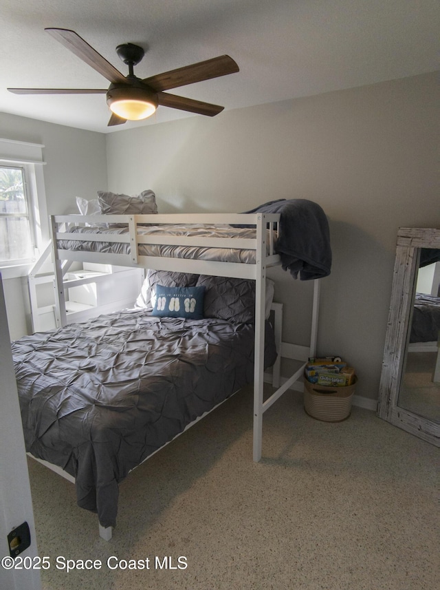 bedroom featuring a ceiling fan and speckled floor