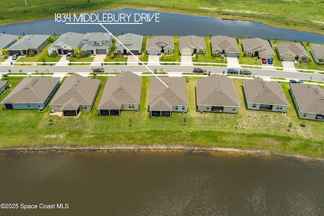 aerial view featuring a residential view and a water view