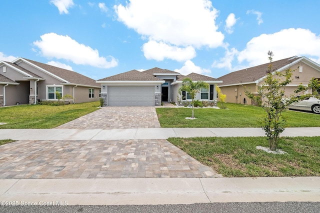 view of front facade featuring decorative driveway, an attached garage, a front lawn, and stucco siding