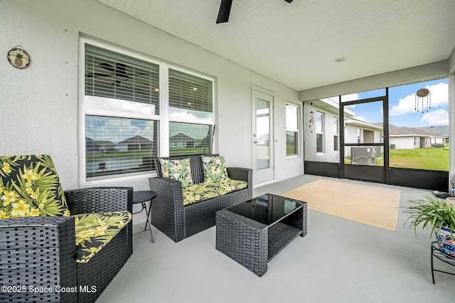 sunroom / solarium with ceiling fan