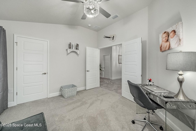 office space featuring visible vents, baseboards, carpet, vaulted ceiling, and a ceiling fan